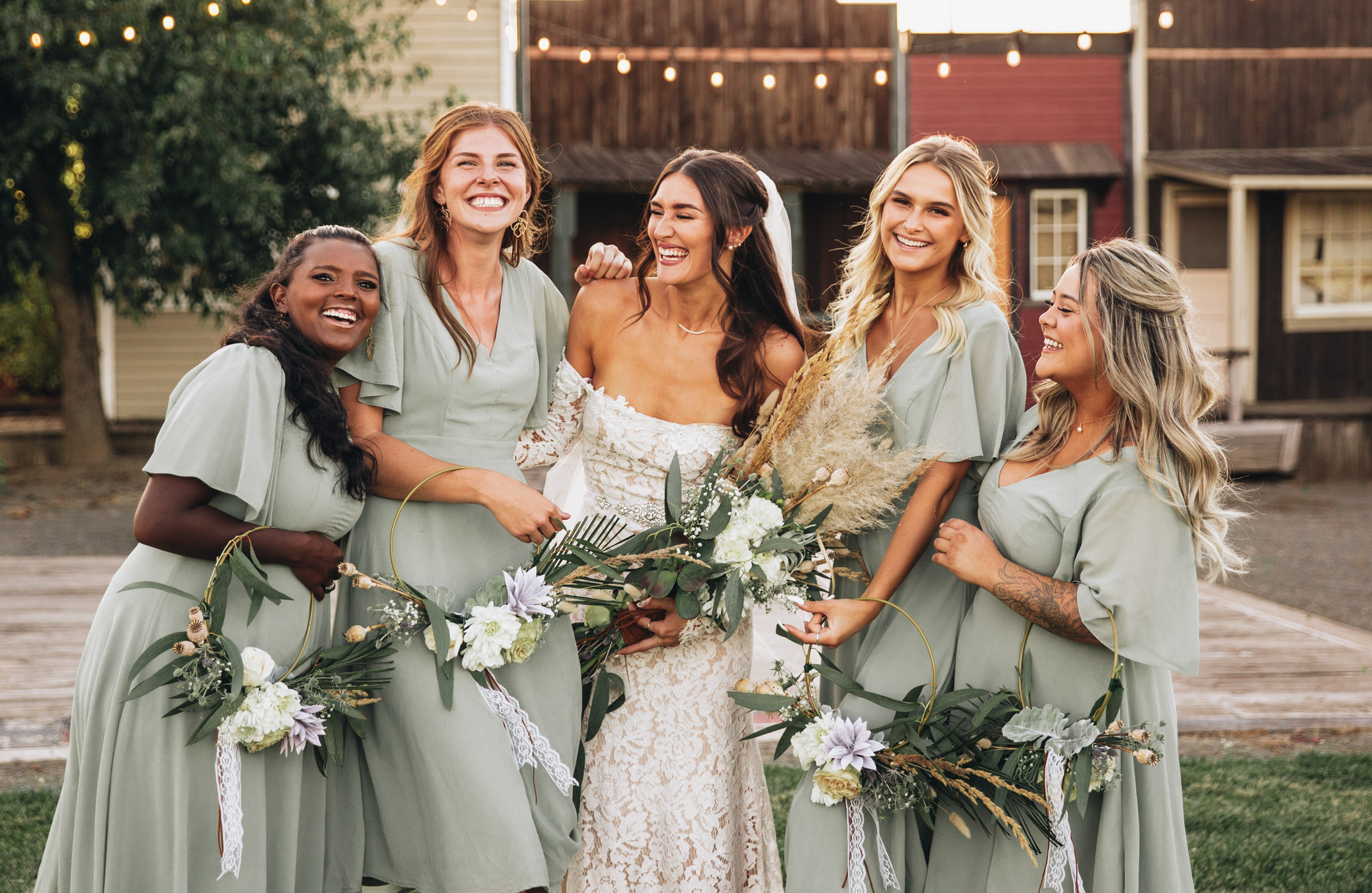 Bride and her bridesmaids laughing at Rossi Farms