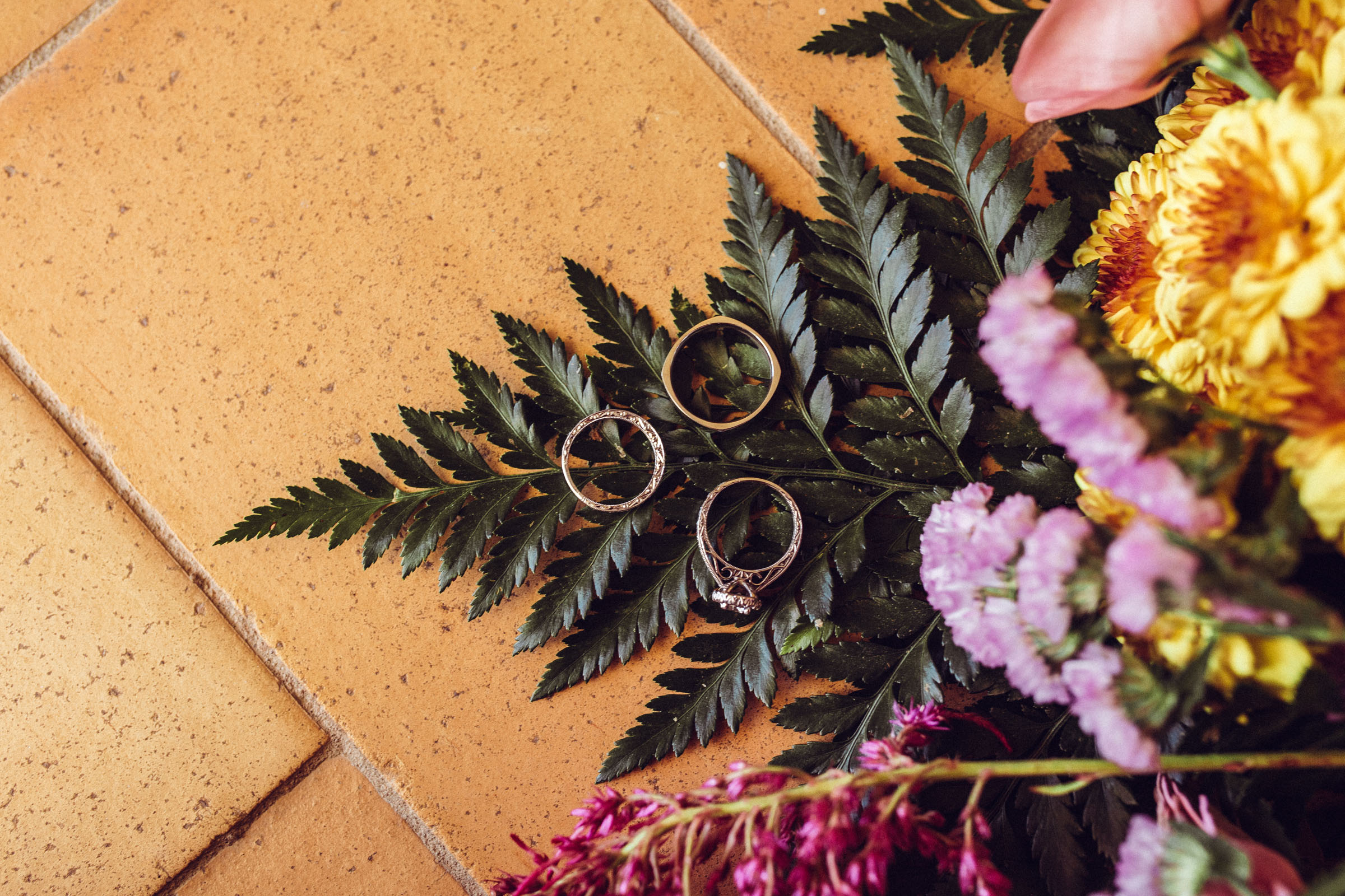 Ring detail shot on fern flower bouquet