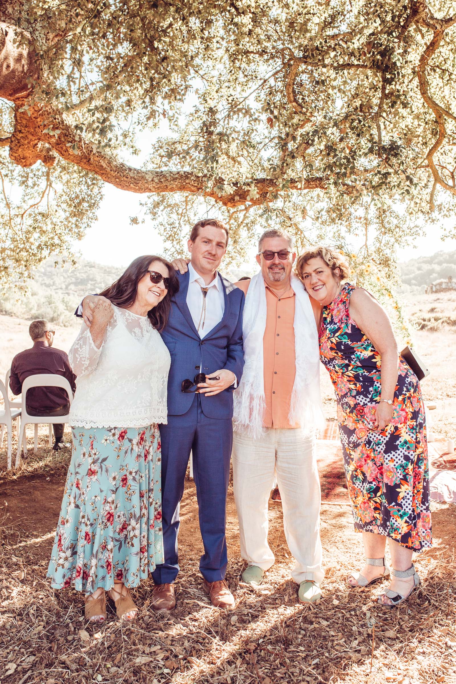 Family under cork trees after wedding Herdade da Matinha portugal