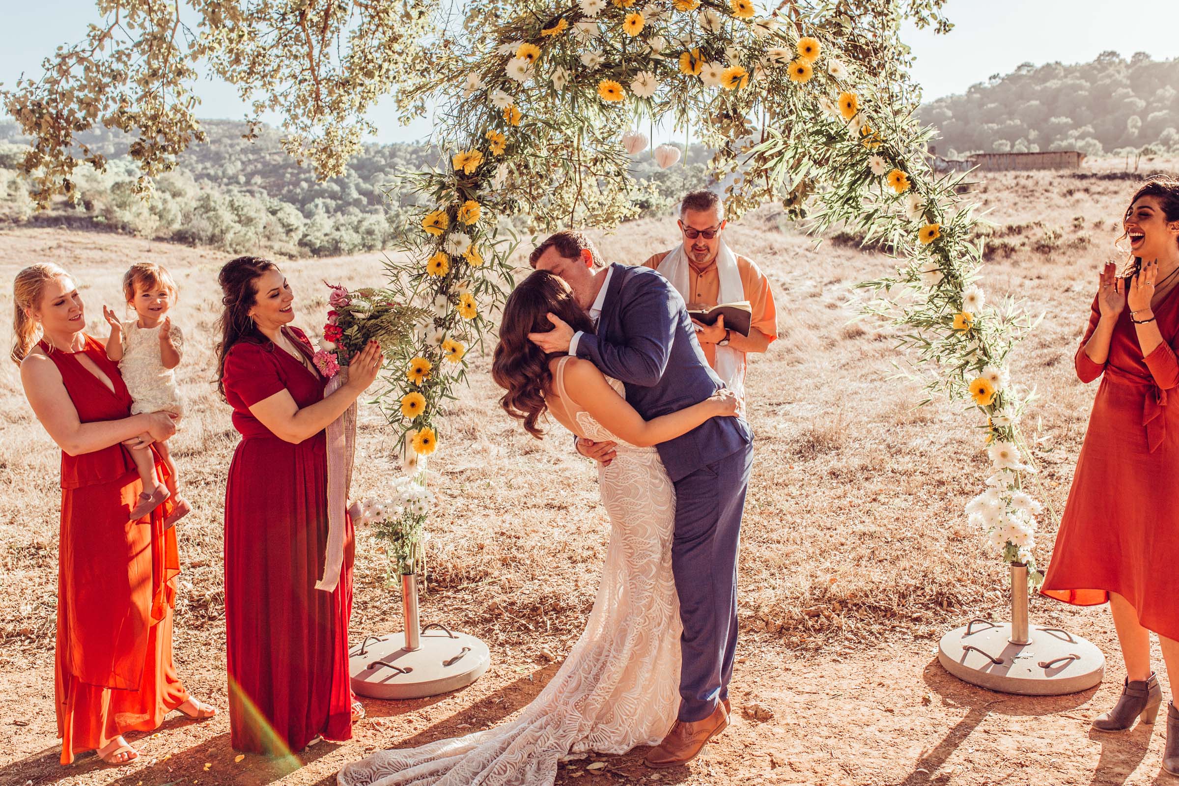 First kiss under cork trees at wedding Herdade da Matinha portugal