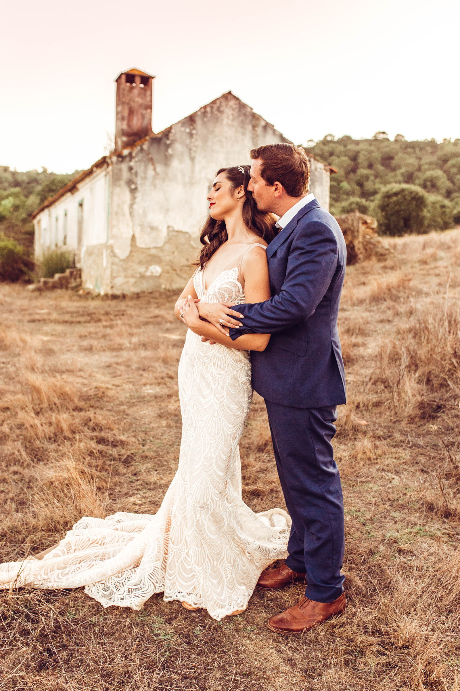 Bride and groom in front of old home at wedding Herdade da Matinha portugal