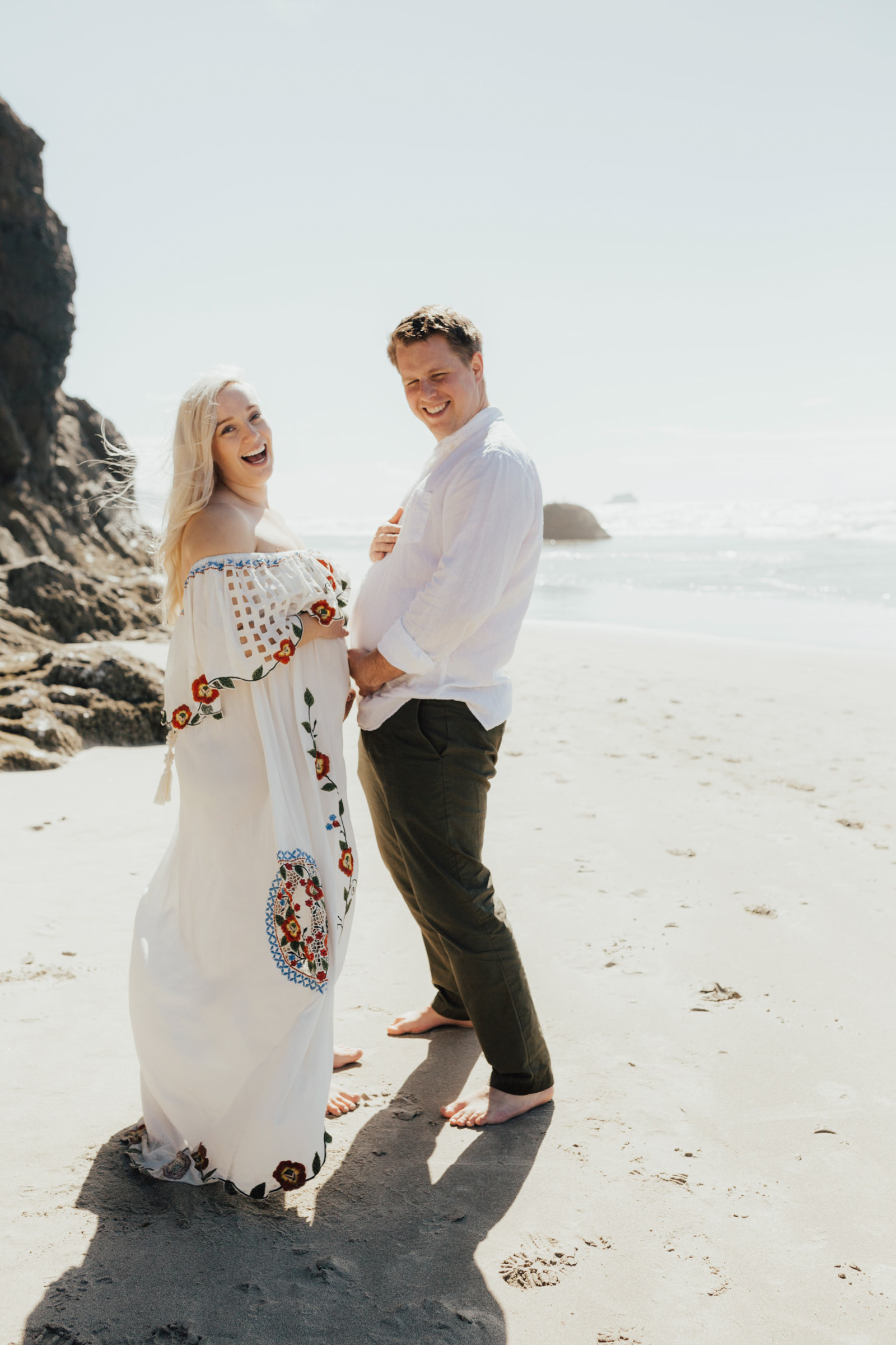 Maternity image of man pretending to be pregnant at Hug Point beach photography