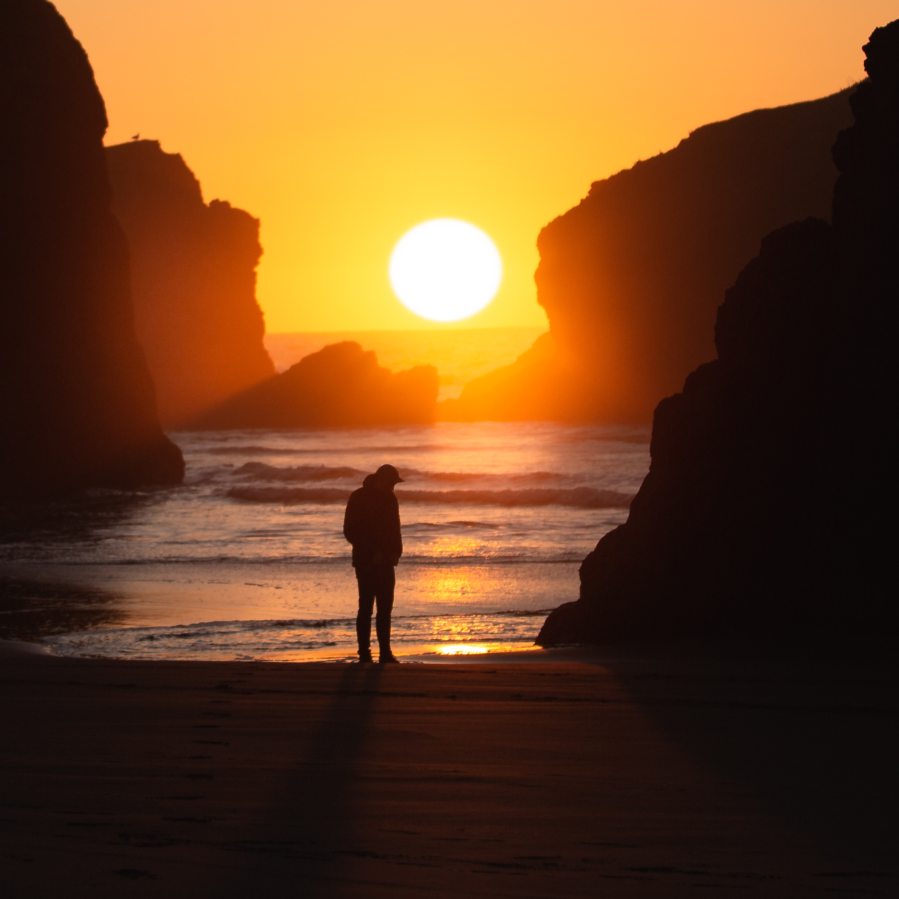 Sunset photography of Andrew Studer standing on the Oregon Coast