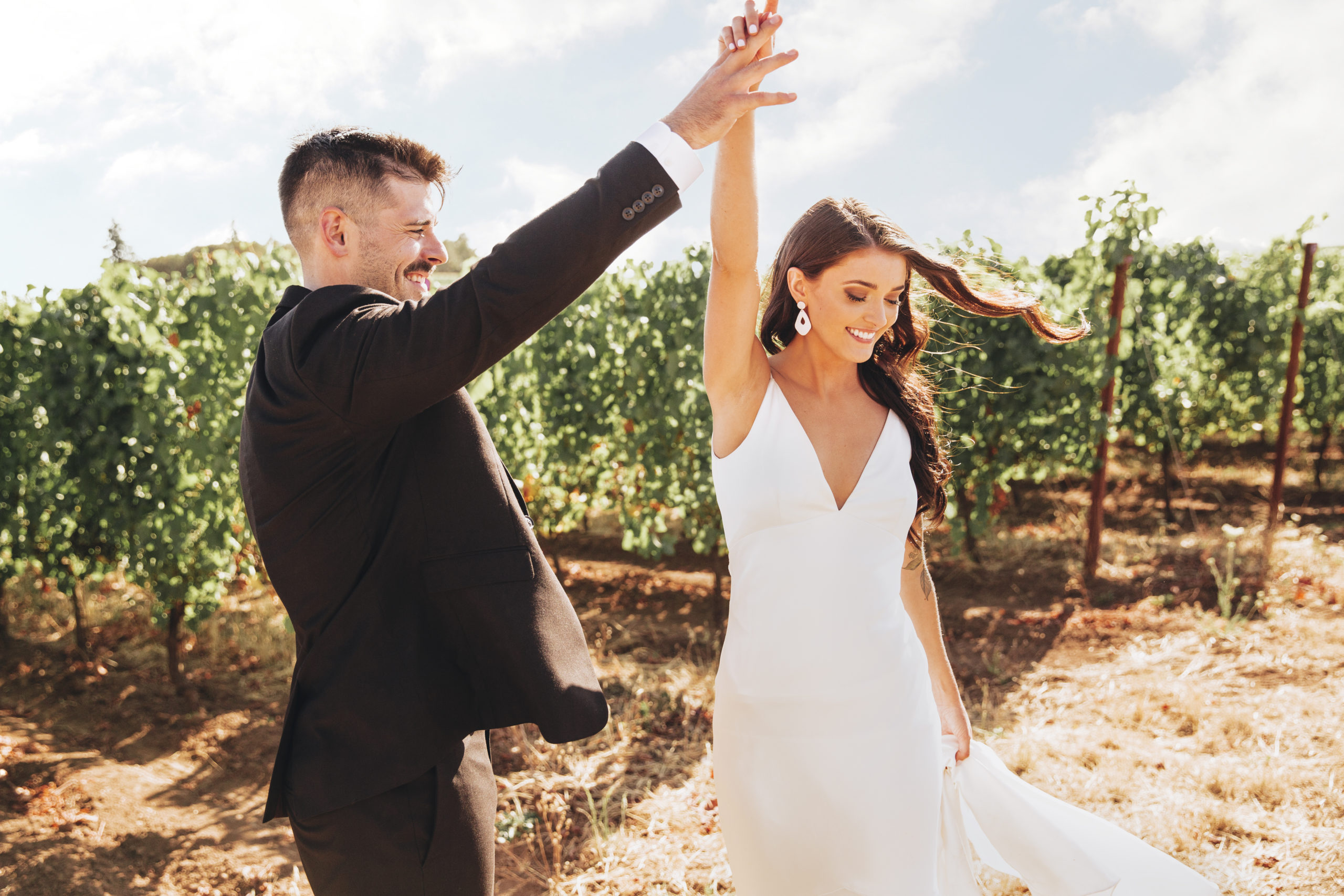 Wedding photography of a couple outdoors dancing