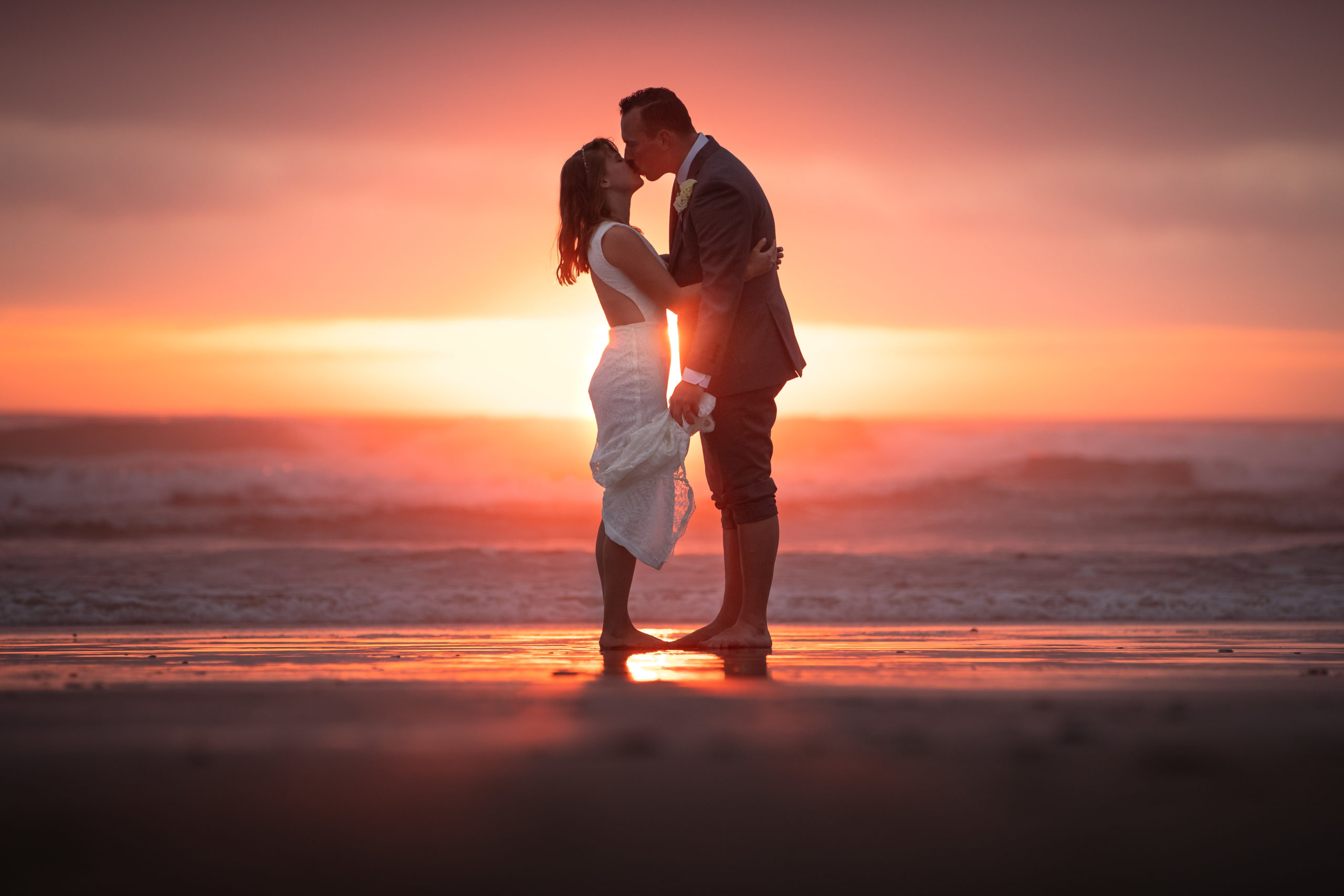 Wedding photography of a couple on the Oregon Coast during a beautiful sunset.