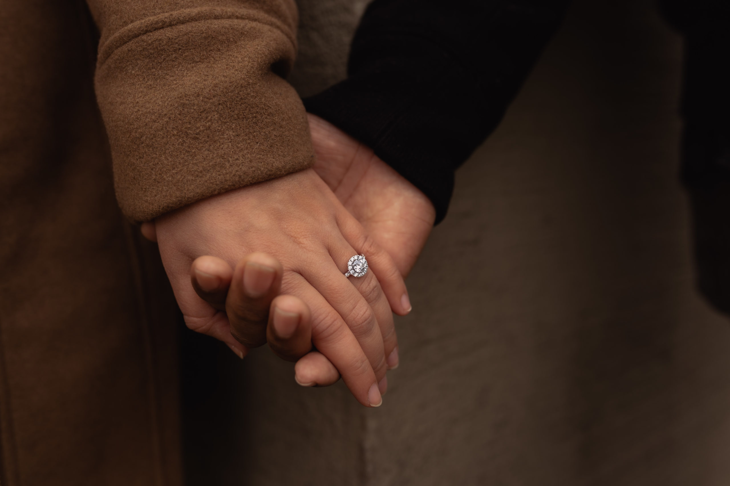 Engagement photography in downtown Portland. Closeup of engagement ring.