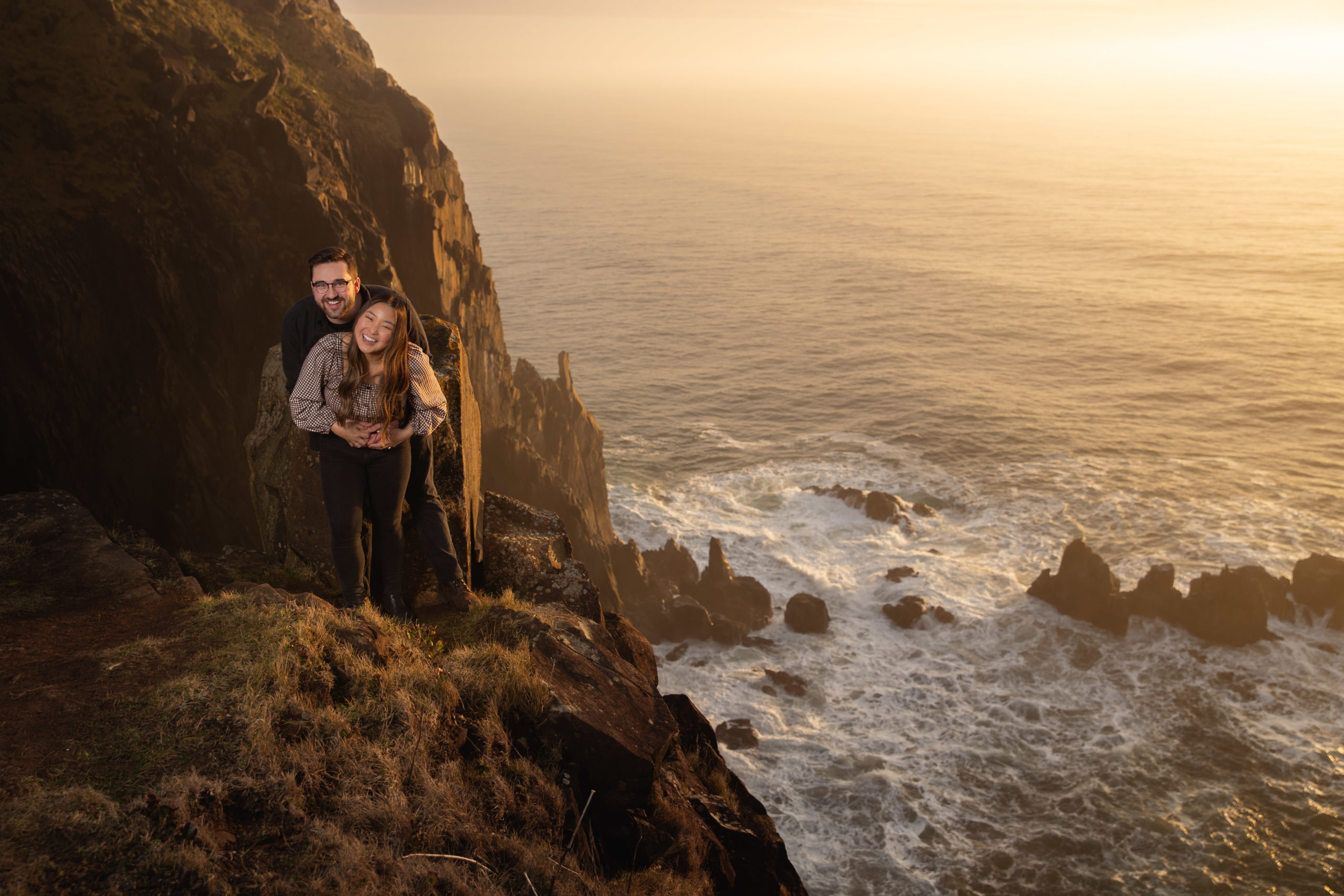Engagement photography taken at Manzanita Cliffs on the Oregon Coast during sunset