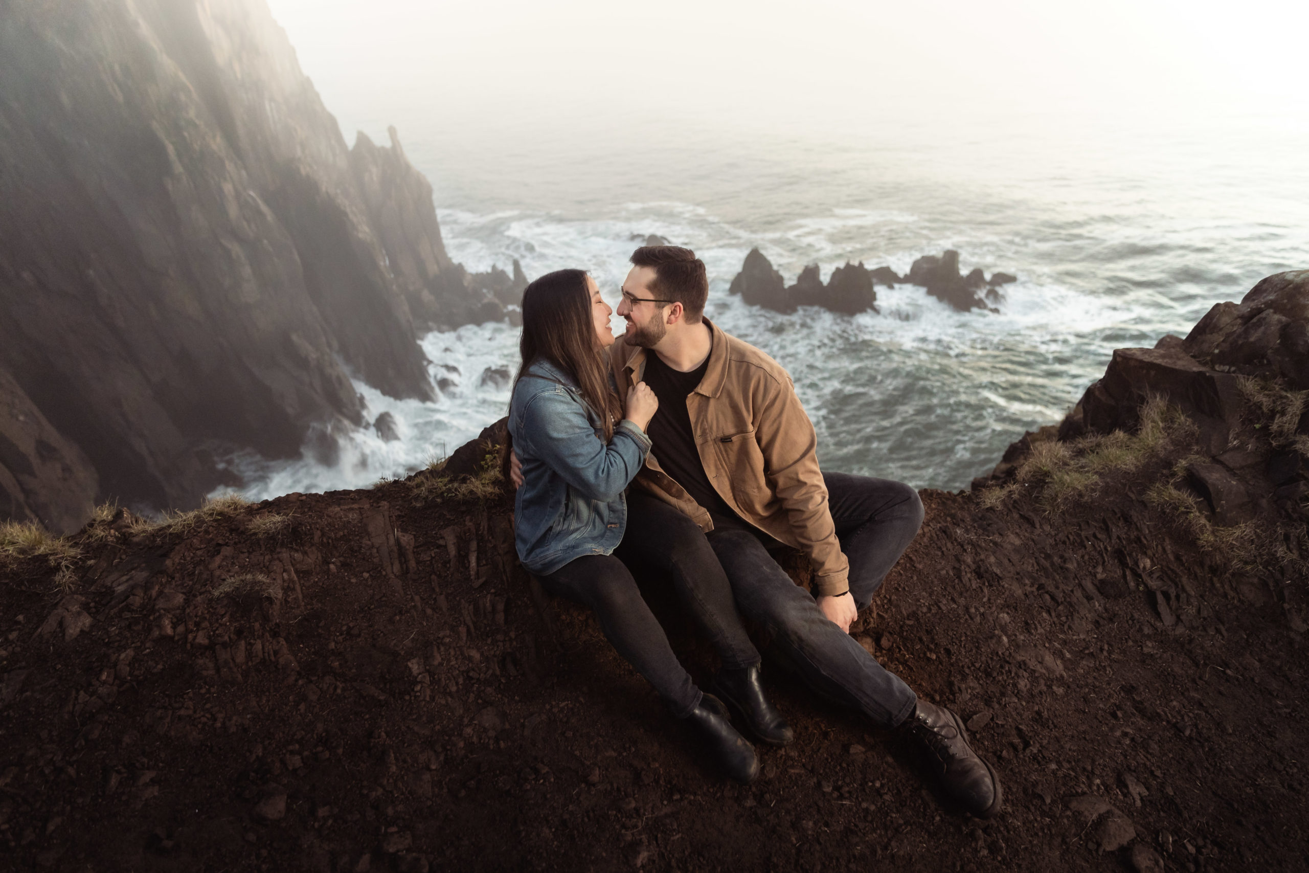 Engagement photography taken at Manzanita Cliffs on the Oregon Coast during sunset