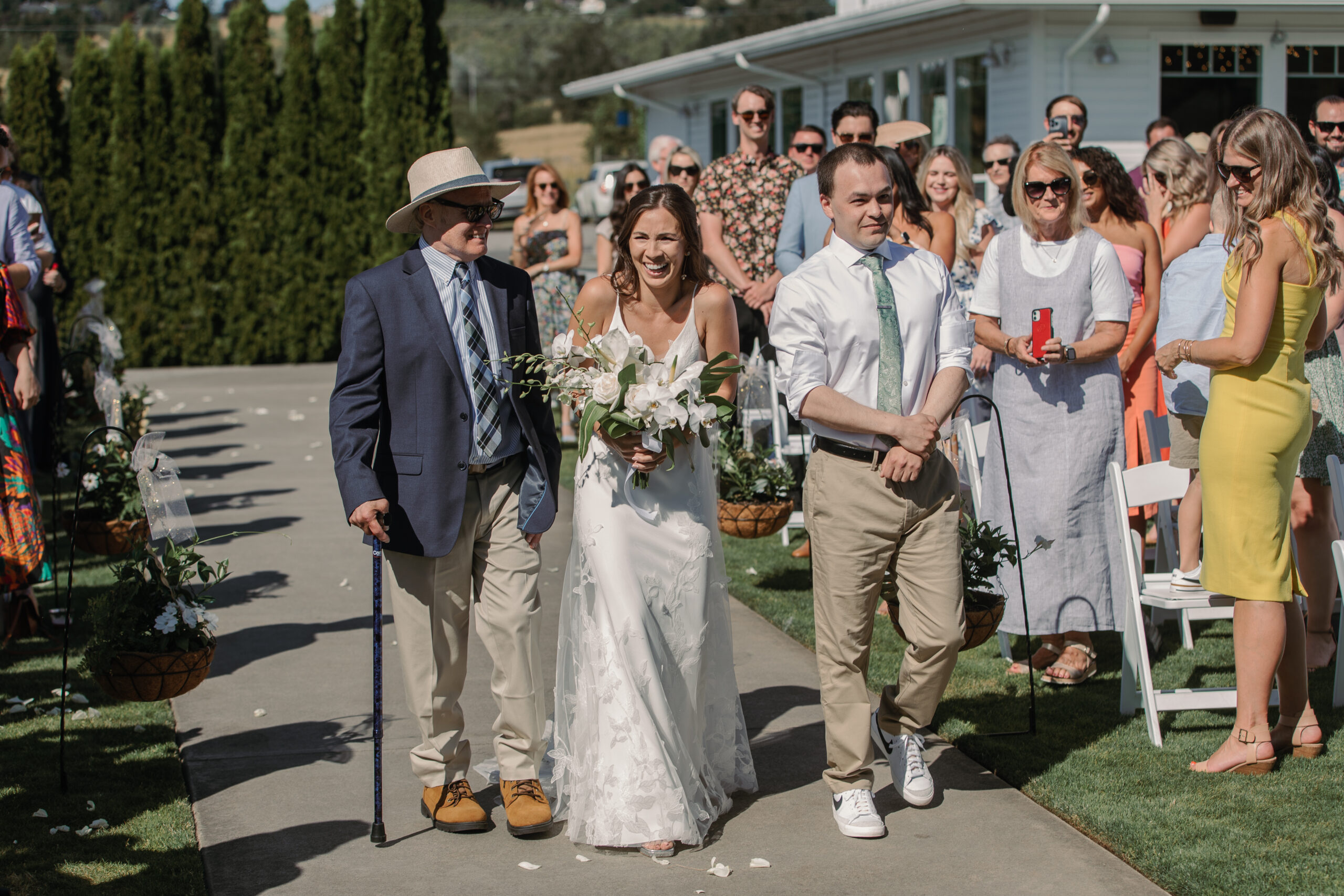 Bride walks down aisle Oswego Hills Vineyard wedding