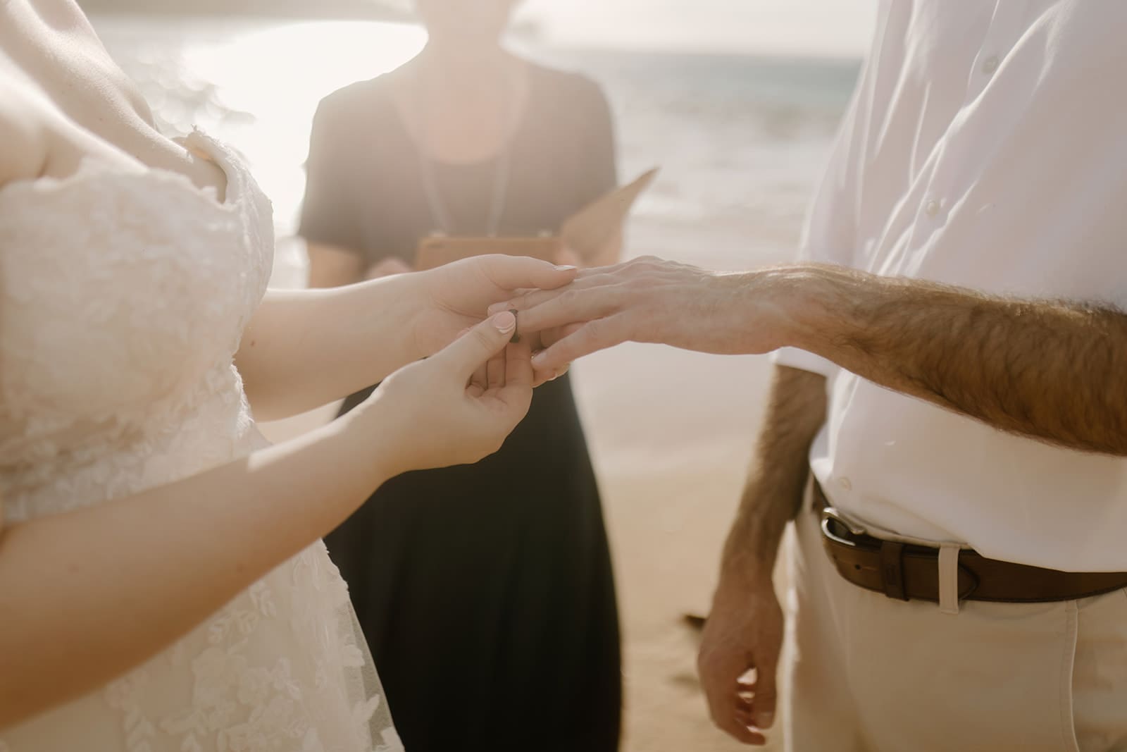 Kauai hawaii Elopement couple on tunnels beach put rings on ceremony